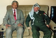 Com Yasser Arafat, presidente da Palestina. 