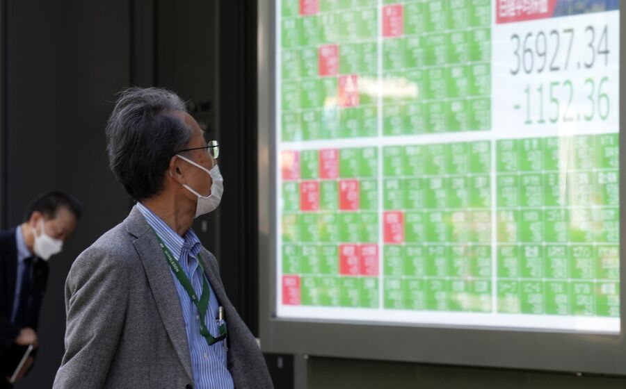 Mercados asiáticos reagem a acordo entre EUA e China, com quedas nos lucros empresariais