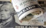 Dólar segue estável à espera de pistas da Fed